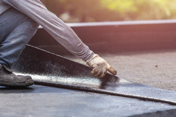 Professional Basement Waterproofing technician working in Hudson, IL